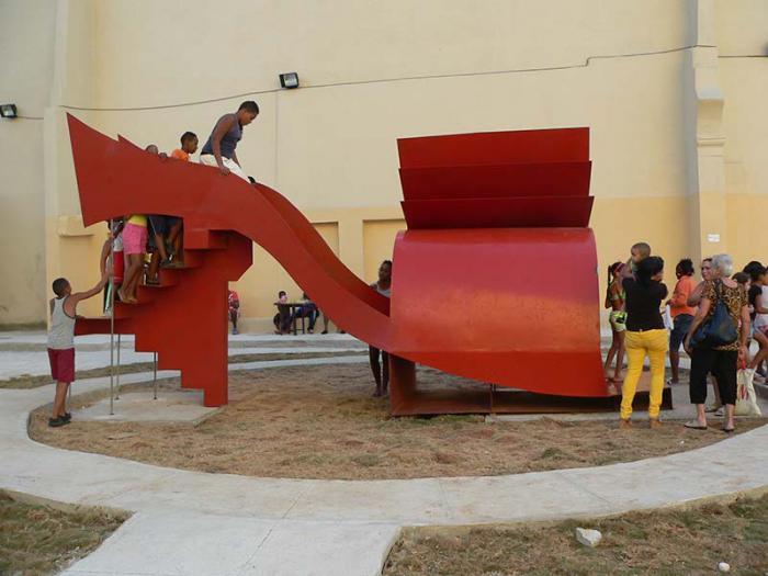 Liudmila López (Cuba) turns a giant sculpture of a woman’s shoe into an interactive slide, in her work Parto a la libertad.