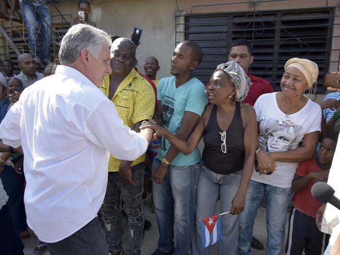 The President visiting a high school in Chicharrones neighborhood.